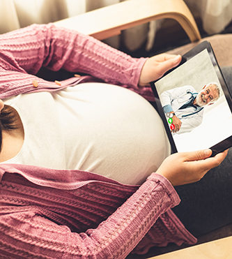 Doctor telemedicine service online video with pregnant woman for